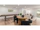 Bright living room featuring wood floors, modern furniture, and access to a swimming pool at 2632 E Mountain View Rd, Phoenix, AZ 85028