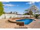 Backyard pool featuring a stone waterfall feature and a large patio area at 2632 E Mountain View Rd, Phoenix, AZ 85028