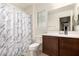 Bathroom featuring a marble shower curtain and vanity at 27878 N 175Th Dr, Surprise, AZ 85387