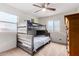 Cozy bedroom features a bunk bed, carpeted floors and bright, natural light at 27878 N 175Th Dr, Surprise, AZ 85387