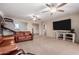 Spacious living room featuring a large-screen TV for entertainment at 27878 N 175Th Dr, Surprise, AZ 85387