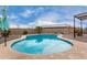 Backyard pool features lounge area and a solar-paneled house in the background at 27878 N 175Th Dr, Surprise, AZ 85387