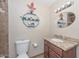 Well-lit bathroom featuring a vanity with granite countertop and stylish decor at 3004 W Anderson Dr, Phoenix, AZ 85053