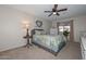 Bedroom featuring a bed, ceiling fan, side table and natural light from the window at 3004 W Anderson Dr, Phoenix, AZ 85053