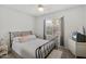 A modest bedroom with modern furnishings and natural light at 3089 E Hazeltine Way, Chandler, AZ 85249