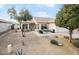 Home exterior boasts a desert landscape, large front yard, and a cozy patio at 3089 E Hazeltine Way, Chandler, AZ 85249