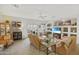 Bright living room featuring a ceiling fan, built-in shelves, plush seating, and backyard access at 3089 E Hazeltine Way, Chandler, AZ 85249