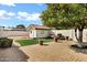 Lush backyard featuring a shed with a tile roof, planters, and beautiful pavers at 3522 E Fountain St, Mesa, AZ 85213