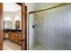 Bright bathroom featuring a glass-enclosed shower and a vanity with vessel sink at 3522 E Fountain St, Mesa, AZ 85213