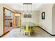 Inviting dining room with pendant lighting, yellow chairs, and sliding door access to outdoor area at 3522 E Fountain St, Mesa, AZ 85213