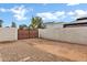 Spacious driveway featuring a gate, offering ample parking and security at 3522 E Fountain St, Mesa, AZ 85213