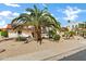 View of the front of a home featuring well-manicured landscaping, a terracotta roof, and solar panels at 3522 E Fountain St, Mesa, AZ 85213