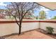 Quaint outdoor patio with brick flooring and lush landscaping, creating a private retreat at 3522 E Fountain St, Mesa, AZ 85213