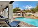 Inviting pool area with lounge chairs, a covered cabana, and lush landscaping at 3522 E Fountain St, Mesa, AZ 85213