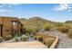 View of exterior with desert landscape, stucco walls, and nearby mountain range at 36600 N Cave Creek Rd # C17, Cave Creek, AZ 85331