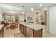 Bright open-concept kitchen featuring a large island, pendant lighting, and views of the dining area and living room at 36600 N Cave Creek Rd # C17, Cave Creek, AZ 85331