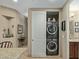 Efficient laundry area featuring a stacked washer and dryer unit and extra storage at 36600 N Cave Creek Rd # C17, Cave Creek, AZ 85331