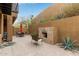 Private patio featuring a tiled fireplace, ideal for outdoor gatherings and enjoying desert sunsets at 36600 N Cave Creek Rd # C17, Cave Creek, AZ 85331