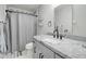 Stylish bathroom featuring modern fixtures, elegant vanity, and a shower-tub combo with decorative tile at 372 W Larona Ln, Tempe, AZ 85284