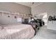 Neutral bedroom featuring a desk area, shelving, and mirrored closet doors at 372 W Larona Ln, Tempe, AZ 85284