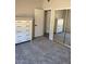 Bedroom with mirrored closet doors and chest of drawers for ample storage space at 372 W Larona Ln, Tempe, AZ 85284