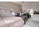 Spacious bedroom with shelves, ceiling fan, carpet, and a mirrored closet at 372 W Larona Ln, Tempe, AZ 85284