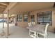 Spacious covered patio provides a cool respite with a table, seating, and views of the backyard at 372 W Larona Ln, Tempe, AZ 85284