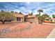 Charming single-story home displaying desert landscaping with a two-car garage at 372 W Larona Ln, Tempe, AZ 85284