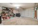 Spacious garage interior with ample storage shelving and a large, functional two-car garage door at 372 W Larona Ln, Tempe, AZ 85284