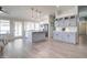 Spacious kitchen with center island, gray cabinets, stainless steel appliances, and modern pendant lighting at 372 W Larona Ln, Tempe, AZ 85284