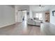 Inviting living room with modern flooring, ceiling fan, and sliding barn door at 372 W Larona Ln, Tempe, AZ 85284