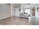 Inviting living room with modern flooring, ceiling fan, and a sliding barn door at 372 W Larona Ln, Tempe, AZ 85284