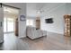 Living room featuring hardwood floors, ceiling fan, and a large grey sectional sofa at 372 W Larona Ln, Tempe, AZ 85284