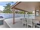 Relaxing covered patio with views of the pool and lush greenery, ideal for outdoor dining and lounging at 372 W Larona Ln, Tempe, AZ 85284