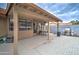 Covered patio with outdoor seating and a grill, creating an ideal space for alfresco dining and relaxation at 372 W Larona Ln, Tempe, AZ 85284