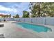 Inviting backyard with a sparkling pool, surrounded by a patio and a privacy wall for secluded relaxation at 372 W Larona Ln, Tempe, AZ 85284