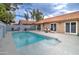 Picturesque backyard offering a refreshing pool, a hot tub, and a patio for outdoor entertainment and relaxation at 372 W Larona Ln, Tempe, AZ 85284