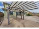 Lovely backyard space with a pergola-covered patio, gravel, mature landscaping, and ample room at 3901 S Adobe Dr, Chandler, AZ 85286