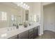 Elegant bathroom features dual sinks, modern fixtures, and a separate shower and tub for a spa-like experience at 3901 S Adobe Dr, Chandler, AZ 85286