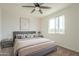 Serene bedroom with plush carpeting, a large window, and a comfortable bed with decorative pillows at 3901 S Adobe Dr, Chandler, AZ 85286