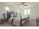 Bright bedroom features neutral tones, a ceiling fan, and ample natural light from multiple windows at 3901 S Adobe Dr, Chandler, AZ 85286