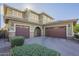 This home features a three-car garage, neutral colors, and beautiful landscaping at 3901 S Adobe Dr, Chandler, AZ 85286