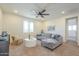 Inviting living room featuring a comfortable sofa, a round coffee table and ample natural light from large windows at 3901 S Adobe Dr, Chandler, AZ 85286