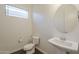 Stylish powder room featuring modern fixtures, tile floor and a unique pedestal sink at 3901 S Adobe Dr, Chandler, AZ 85286