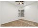 A modern bedroom featuring neutral tones, light carpet, and natural lighting at 40614 N Harbour Town Ct, Anthem, AZ 85086