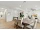 Open dining area featuring a wood table for six, and views of the front living area at 40614 N Harbour Town Ct, Anthem, AZ 85086