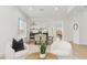 Elegant dining area with a table for six, view to the backyard, and modern furnishings at 40614 N Harbour Town Ct, Anthem, AZ 85086