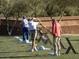 Golfers practicing at a driving range with balls and coaching equipment available at 40614 N Harbour Town Ct, Anthem, AZ 85086