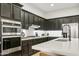 Modern kitchen featuring stainless steel appliances, a breakfast bar, and plenty of storage at 40614 N Harbour Town Ct, Anthem, AZ 85086