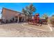 Expansive backyard featuring a playset and views of the home's balcony at 41838 W Anne Ln, Maricopa, AZ 85138